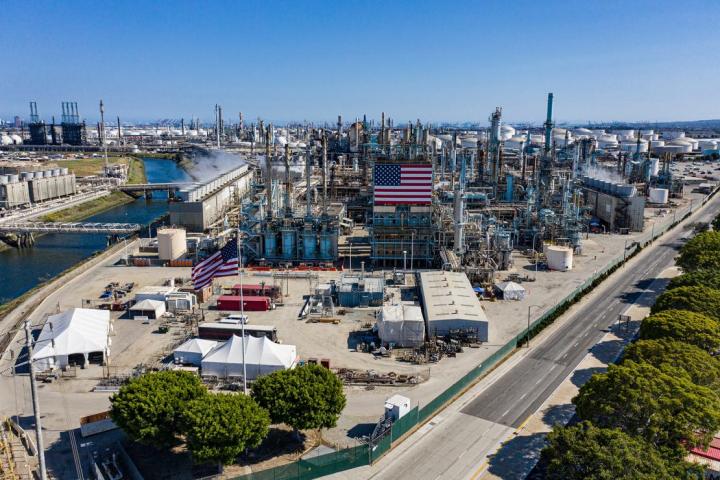refinery with American flags